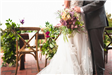 Bride and Groom in Front of Table, Bride Holding Bouquet
