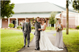 Bride and Groom and Members of Wedding Party in Front of Sanborn Center
