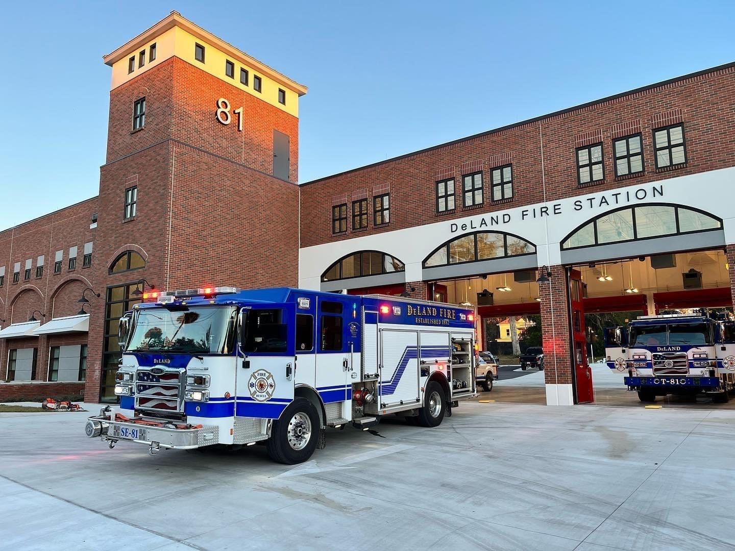 Completed Fire Station 81 with Open Garage Doors and Trucks